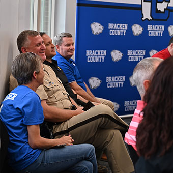Group of officers and people sitting down. Read about Gifts of Life Insurance Group of officers and people sitting down. Read about Gifts of Life Insurance