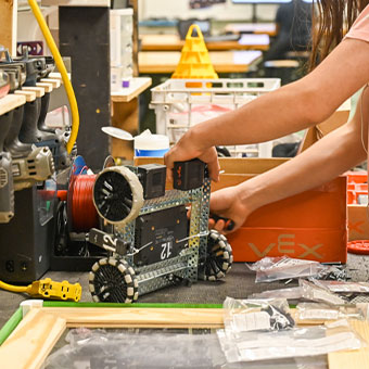 Person working on a robot. Read about Gifts from Retirement Plans Person working on a robot. Read about Gifts from Retirement Plans