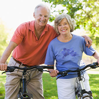 Older couple on bikes. Link to Life Stage Gift Planner Ages 45-65 Situations.